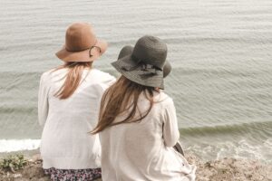 beach, hats, women, pair, couple, fashion, style, stylish, backs, young women, shore, seashore, nature, friendship, girl friends, ocean, outdoors, people, sand, sea, water, friends